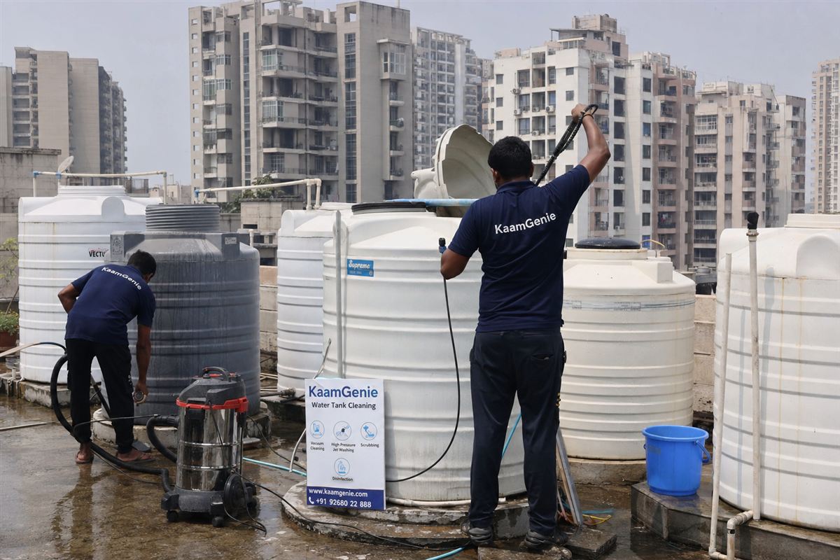 KaamGenie crew cleaning a water tank in Sector 84, Faridabad