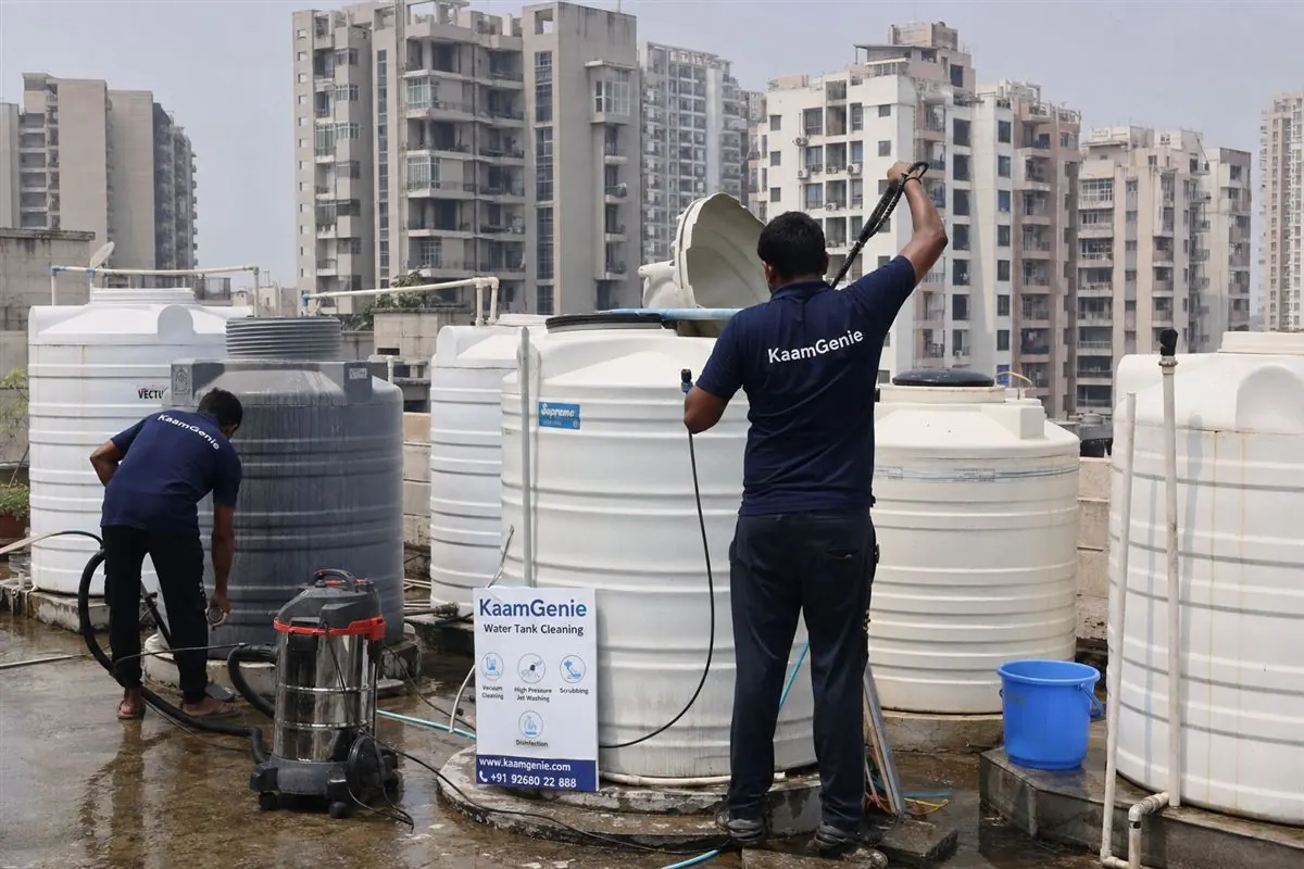 KaamGenie crew cleaning a water tank in Sector 84, Faridabad