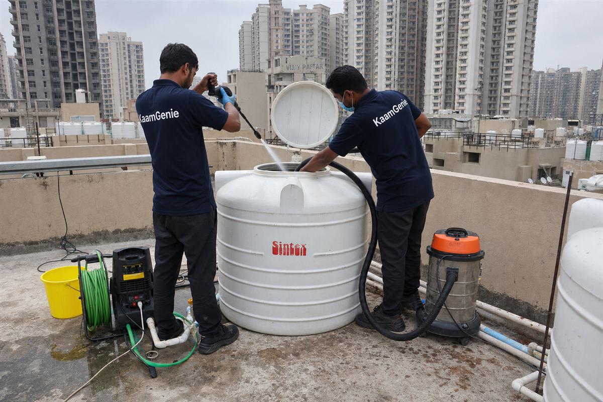 KaamGenie crew cleaning a water tank in Sector 87, Faridabad