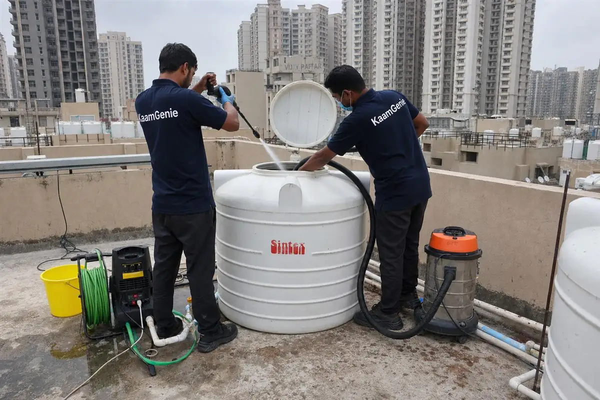 KaamGenie crew cleaning a water tank in Sector 87, Faridabad