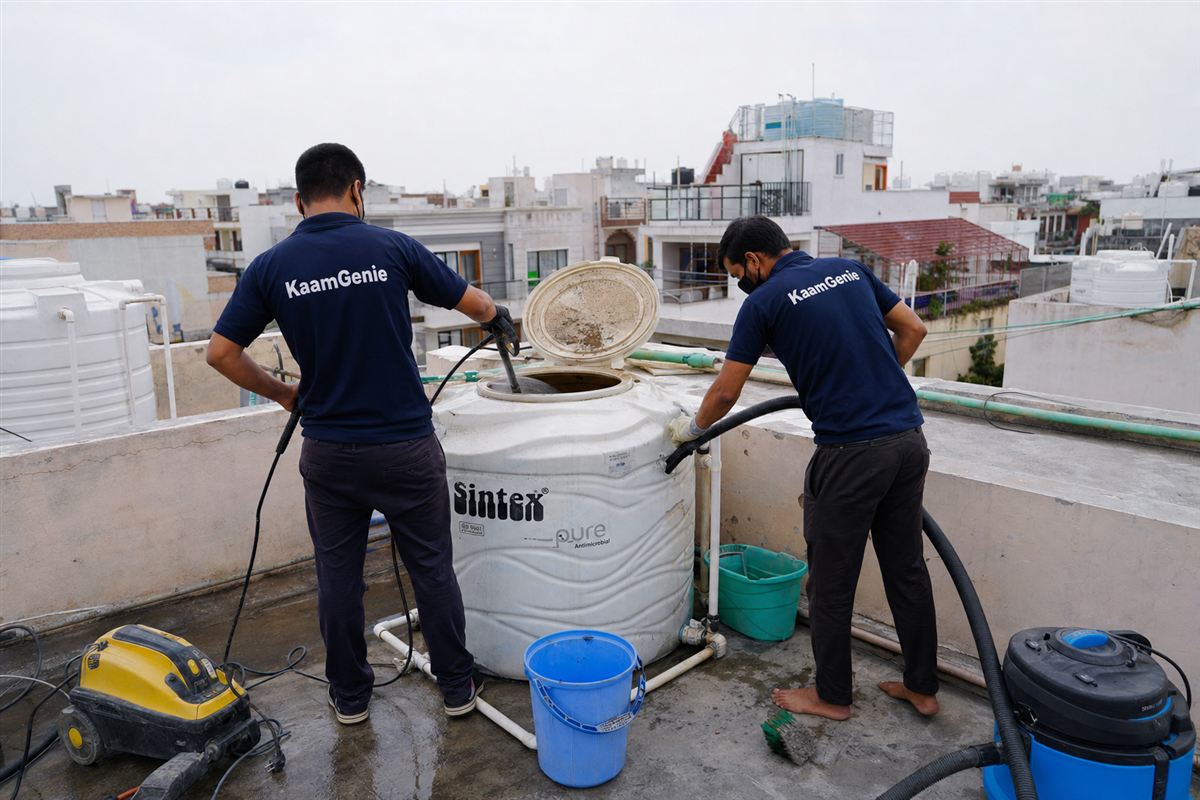 KaamGenie crew cleaning a water tank in Sector 9, Faridabad