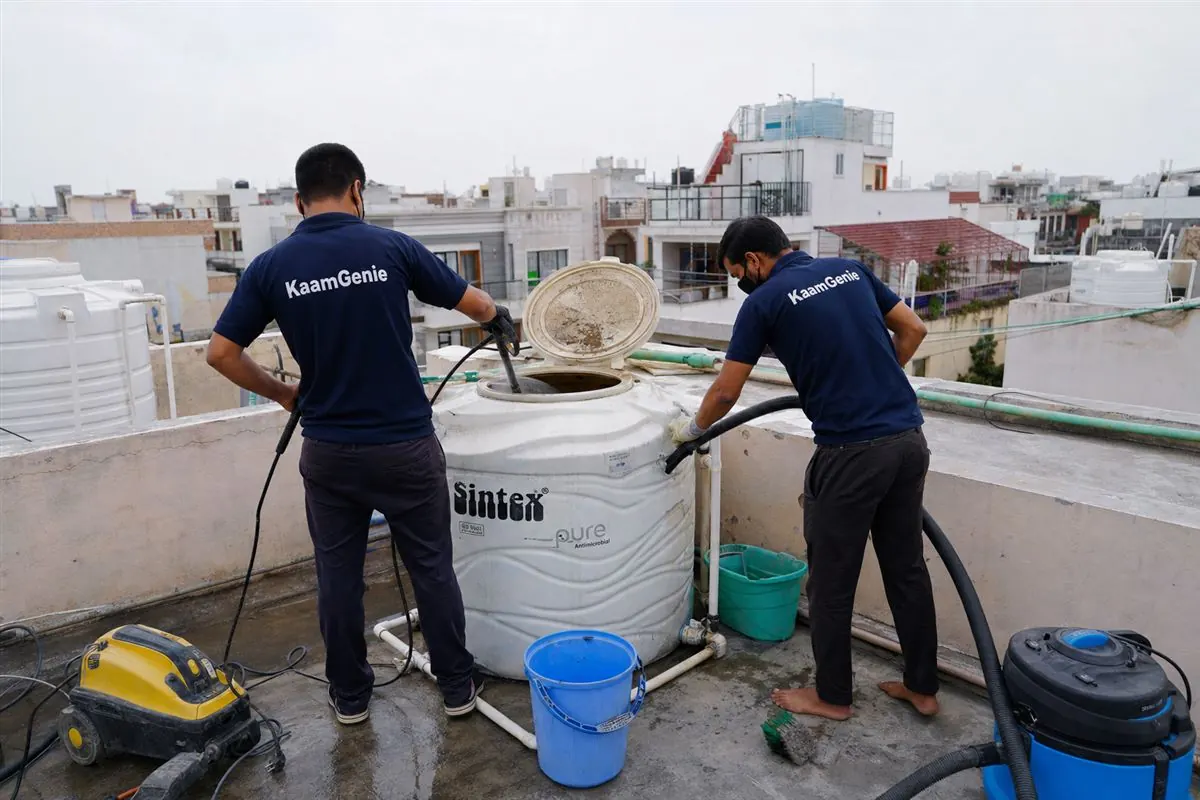 KaamGenie crew cleaning a water tank in Sector 9, Faridabad