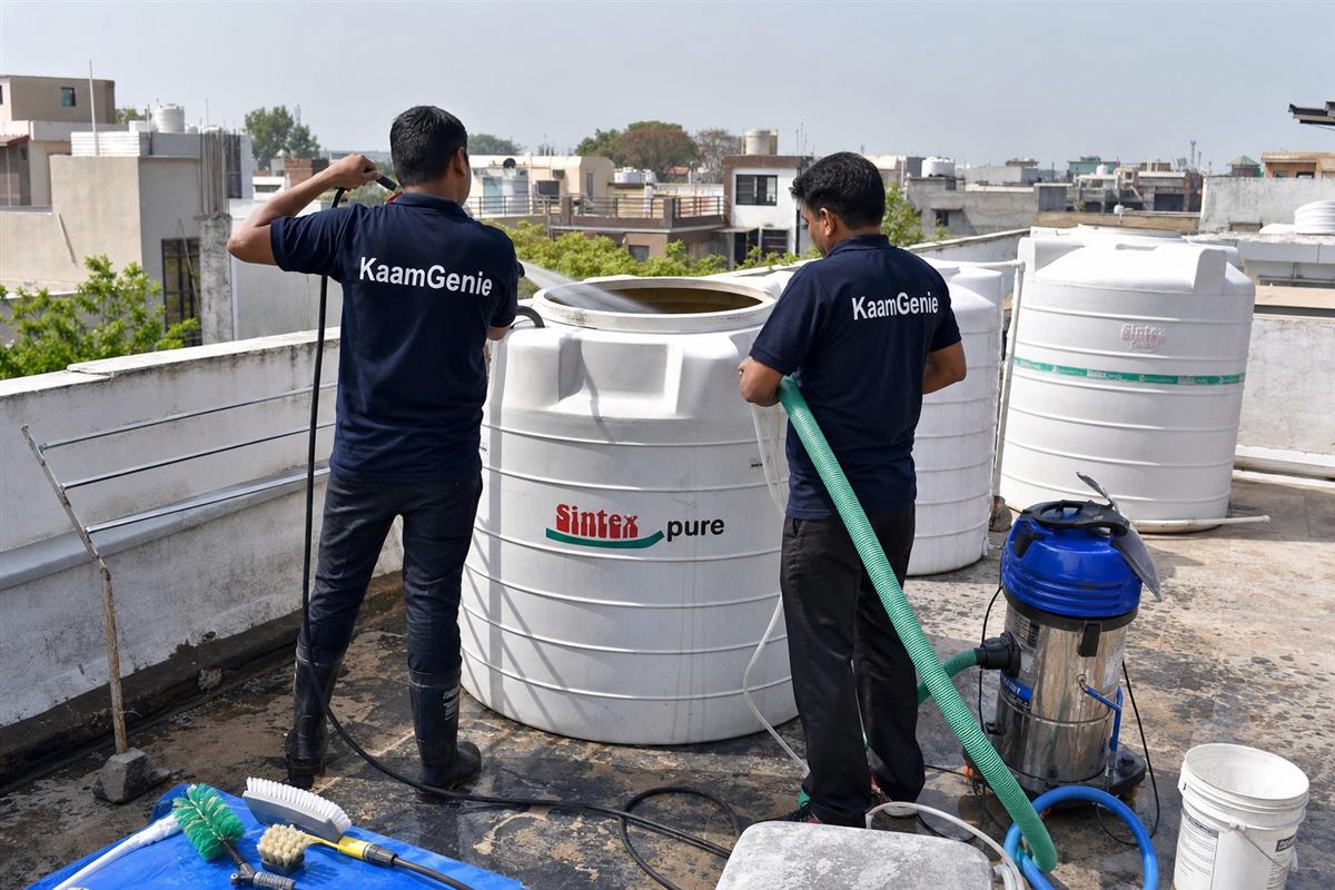 KaamGenie crew cleaning a water tank in Spring Field Colony, Faridabad