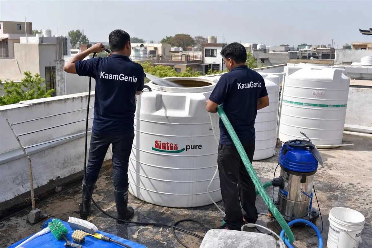 KaamGenie crew cleaning a water tank in Spring Field Colony, Faridabad