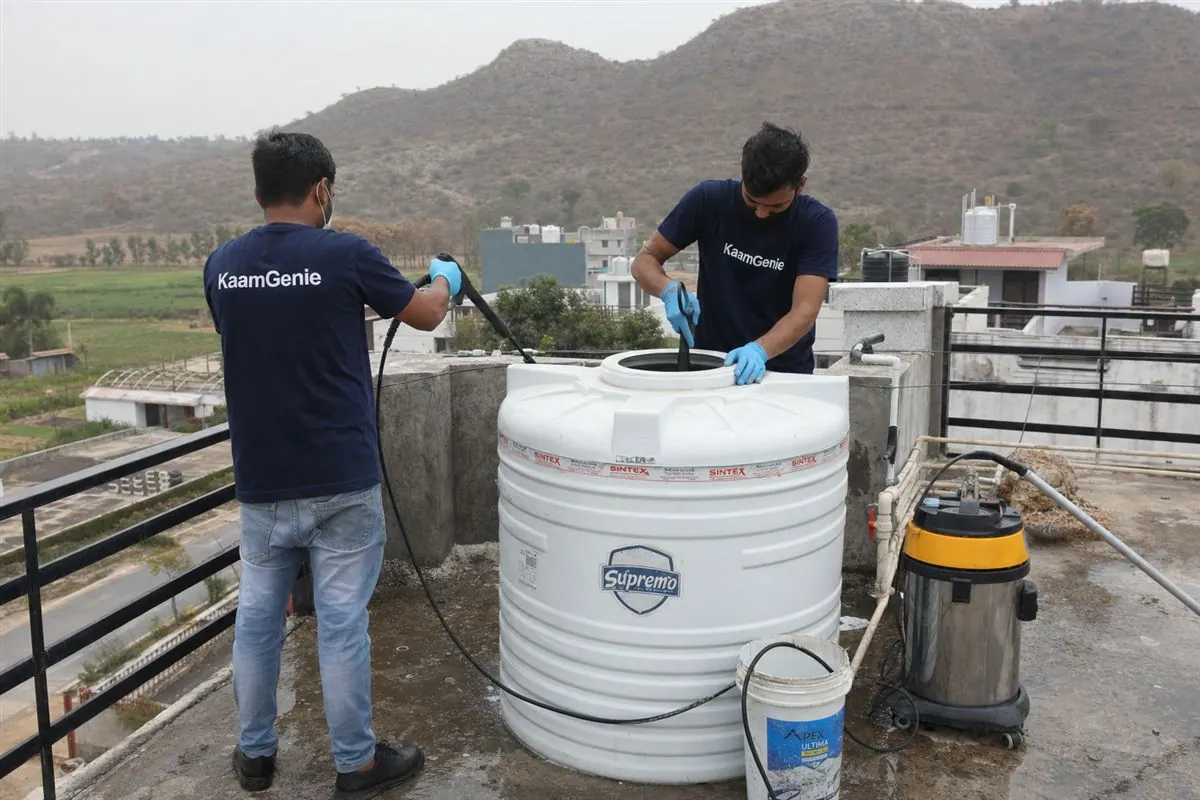 KaamGenie crew cleaning a water tank in Tilpat, Faridabad