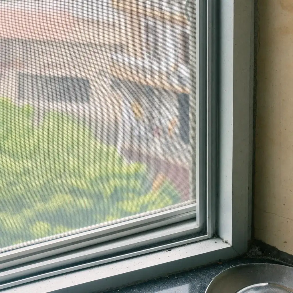 Fine mesh fly screen fitted on a Delhi kitchen window to keep houseflies out