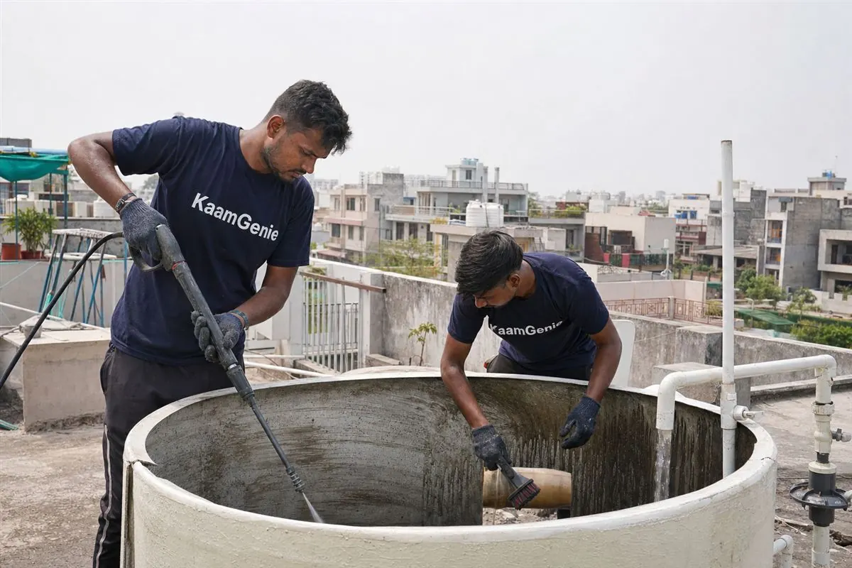 KaamGenie crew cleaning a water tank in Phi, Greater Noida