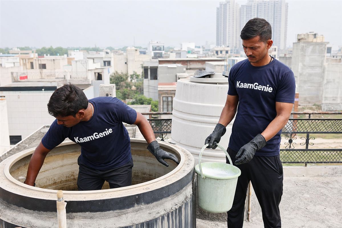 KaamGenie crew cleaning a water tank in Pi, Greater Noida