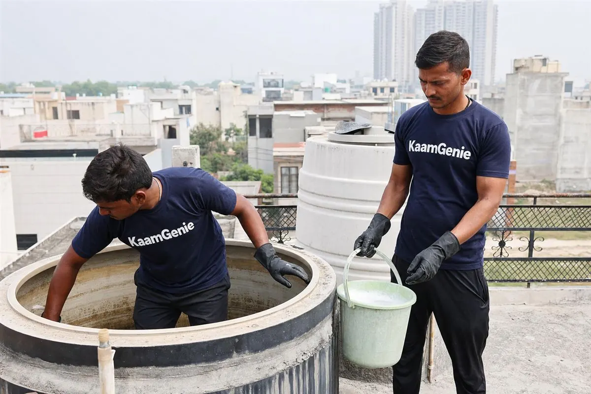 KaamGenie crew cleaning a water tank in Pi, Greater Noida
