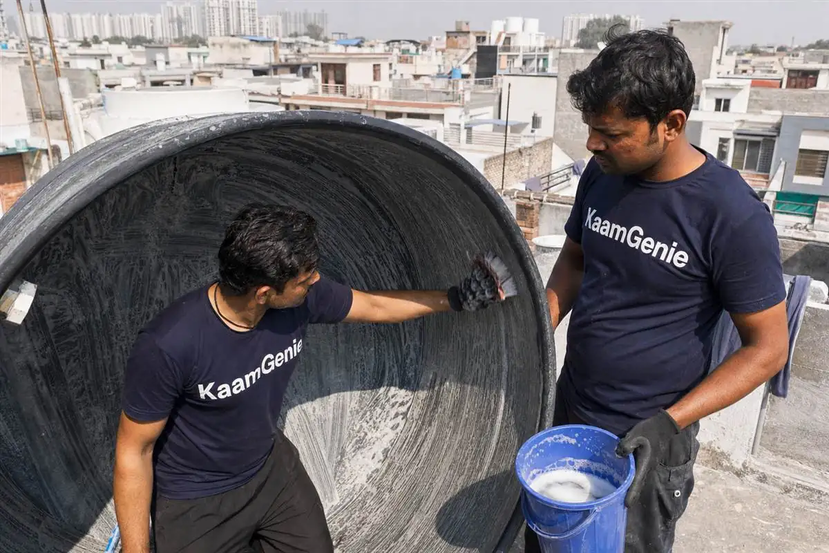 KaamGenie crew cleaning a water tank in Swarn Nagari, Greater Noida