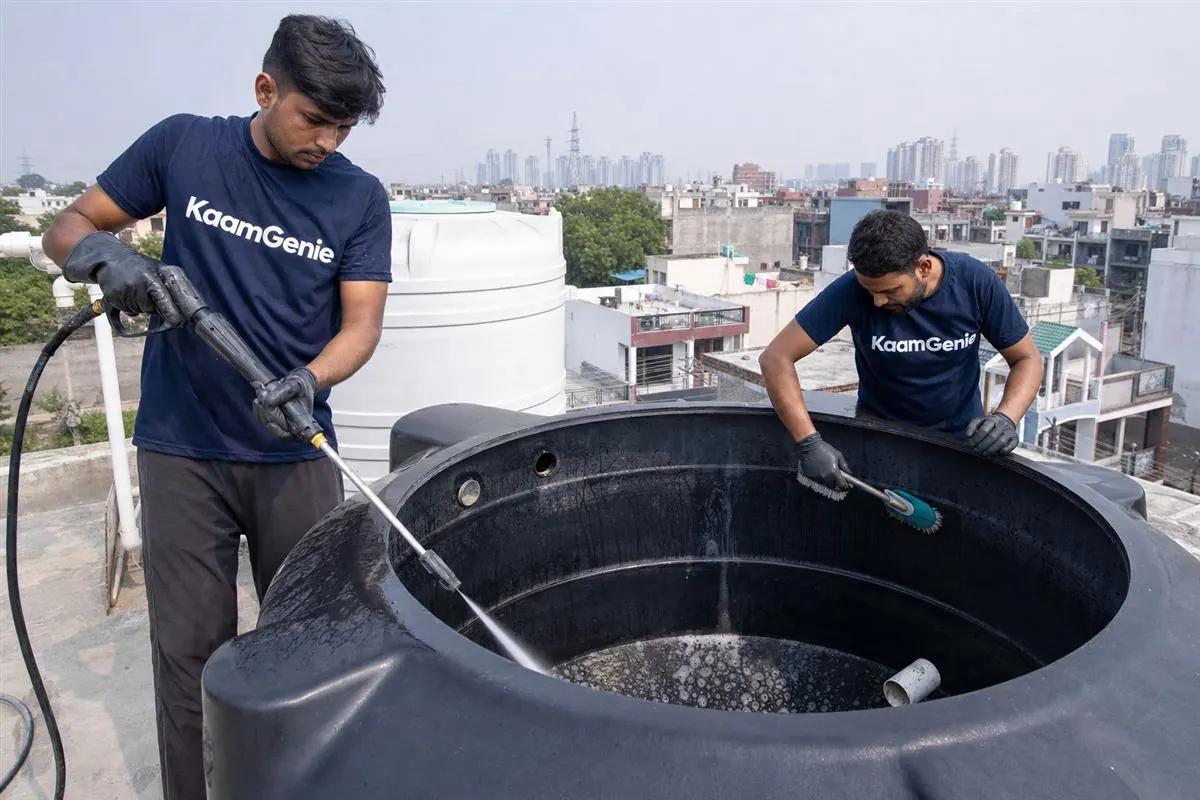 KaamGenie crew cleaning a water tank in Zeta, Greater Noida
