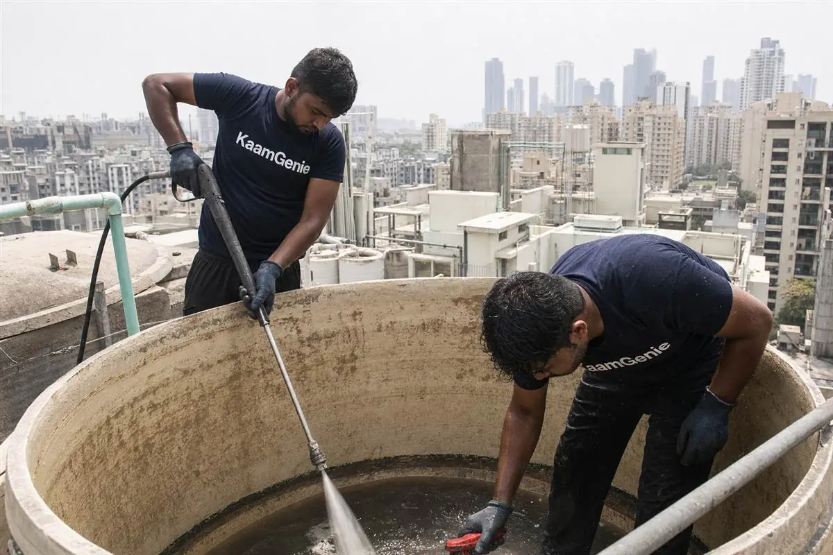 KaamGenie crew cleaning a water tank in Ardee City, Gurgaon