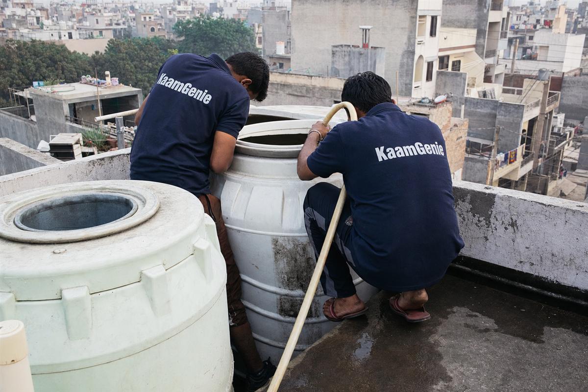 KaamGenie crew cleaning a water tank in Dundahera, Gurgaon