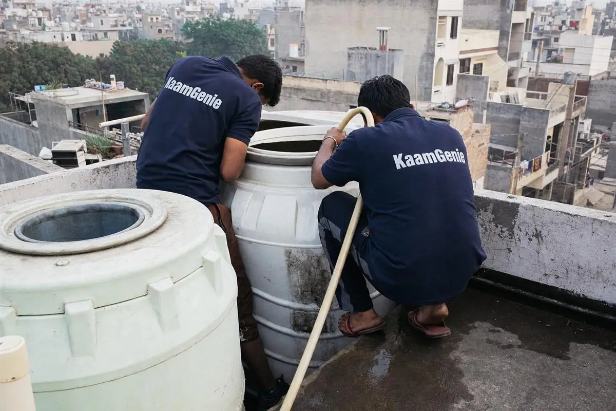 KaamGenie crew cleaning a water tank in Dundahera, Gurgaon