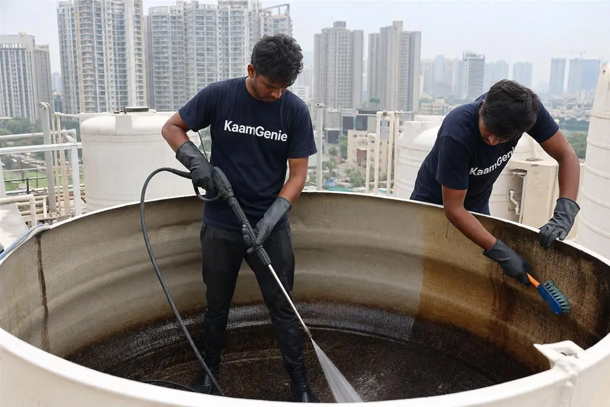 KaamGenie crew cleaning a water tank in Golf Course Extension Road, Gurgaon