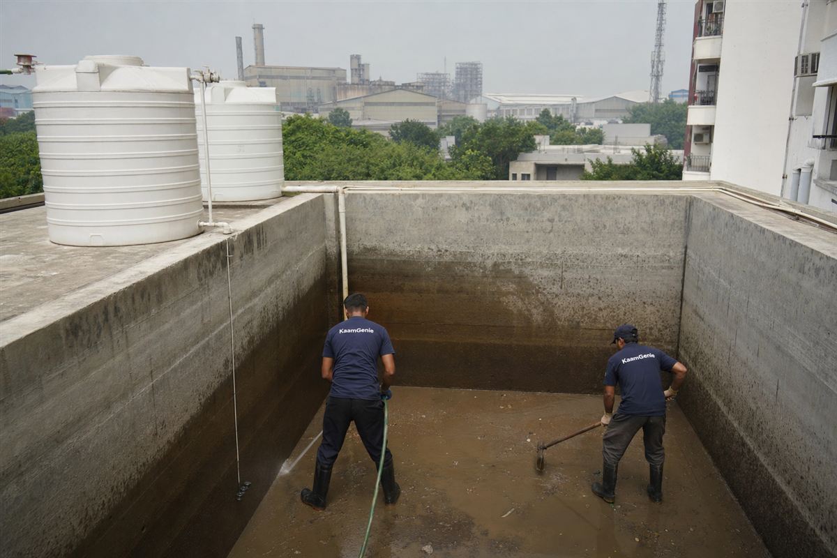 KaamGenie crew cleaning a water tank in IMT Manesar, Gurgaon