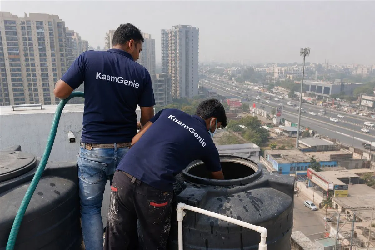KaamGenie crew cleaning a water tank in Kherki Daula, Gurgaon