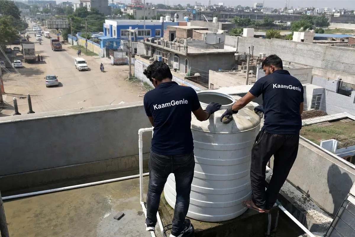 KaamGenie crew cleaning a water tank in Manesar, Gurgaon