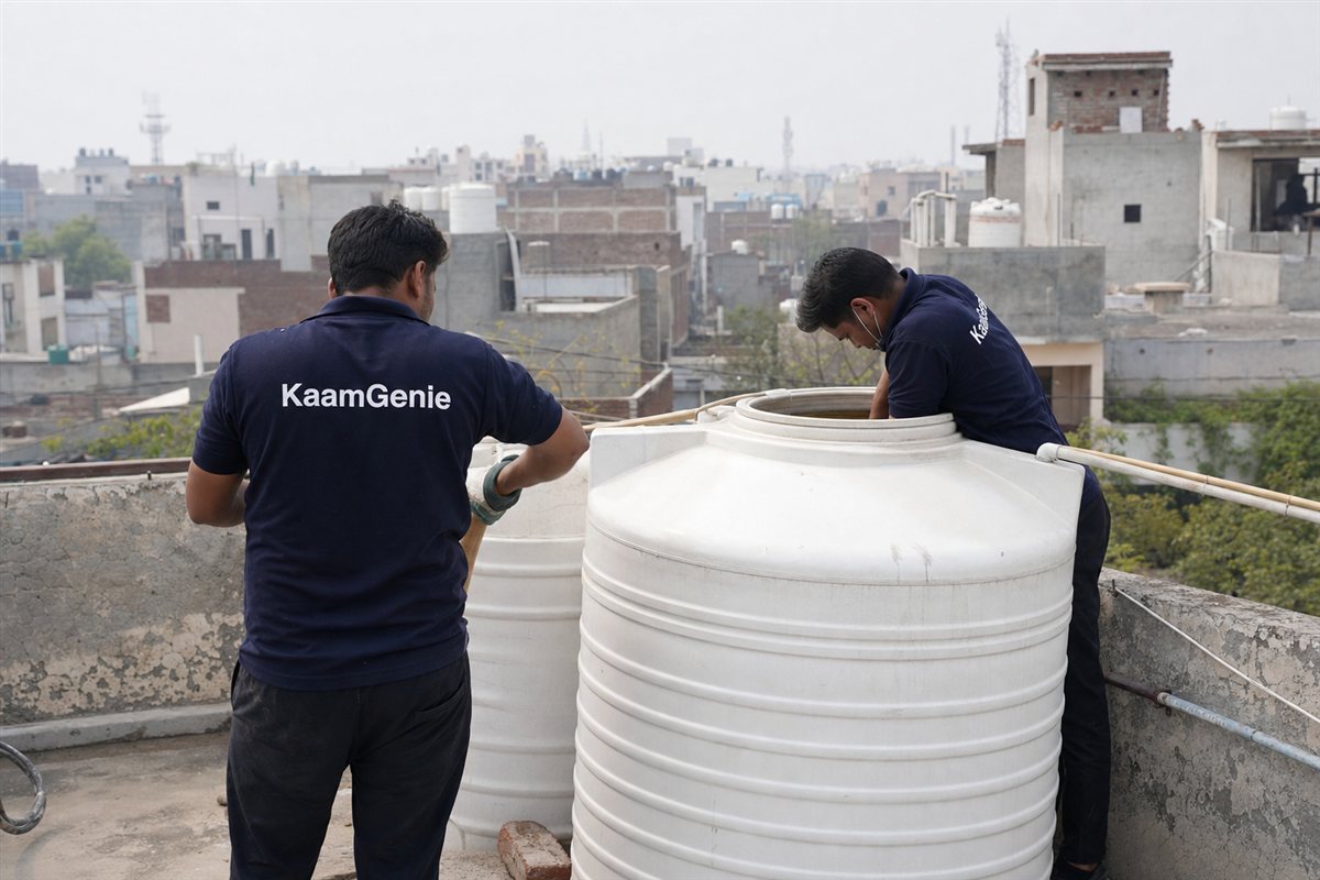 KaamGenie crew cleaning a water tank in Sarhaul, Gurgaon