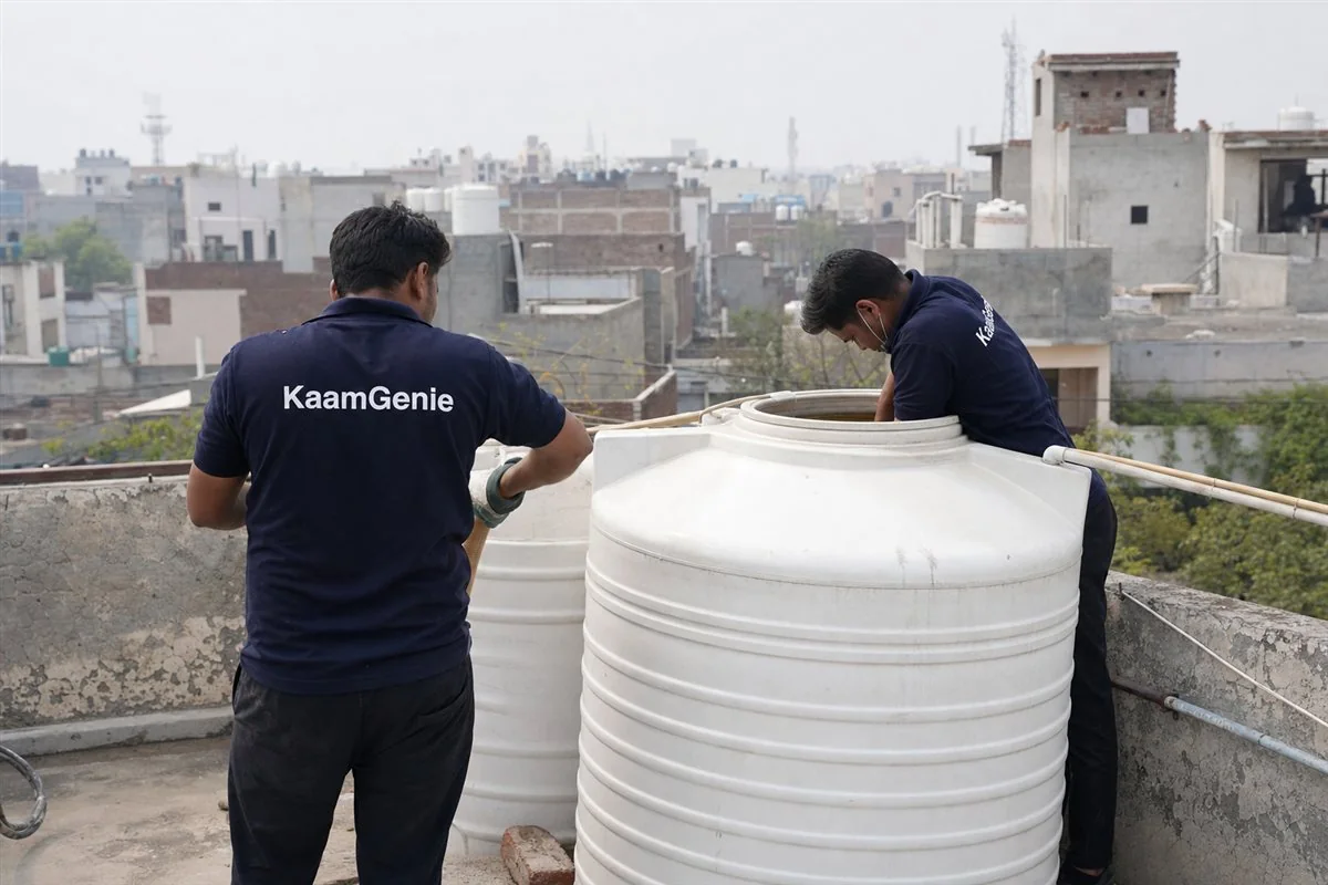 KaamGenie crew cleaning a water tank in Sarhaul, Gurgaon