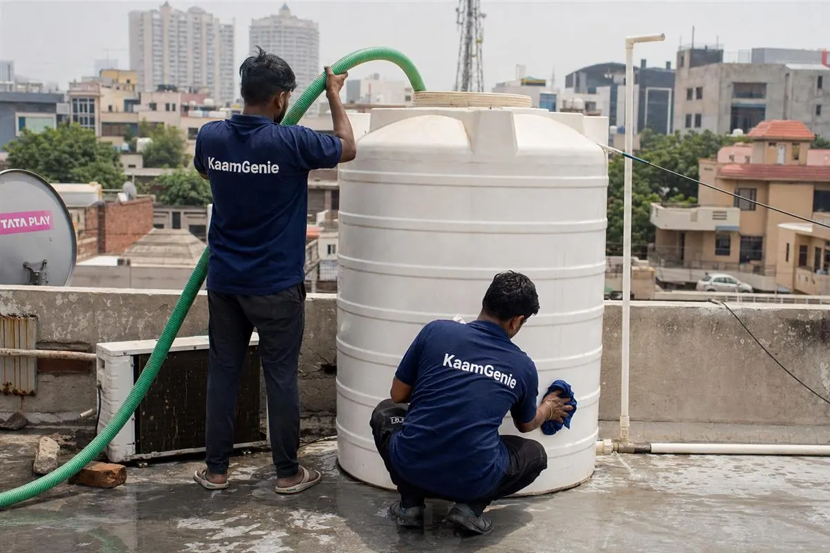KaamGenie crew cleaning a water tank in Sector 1, Gurgaon