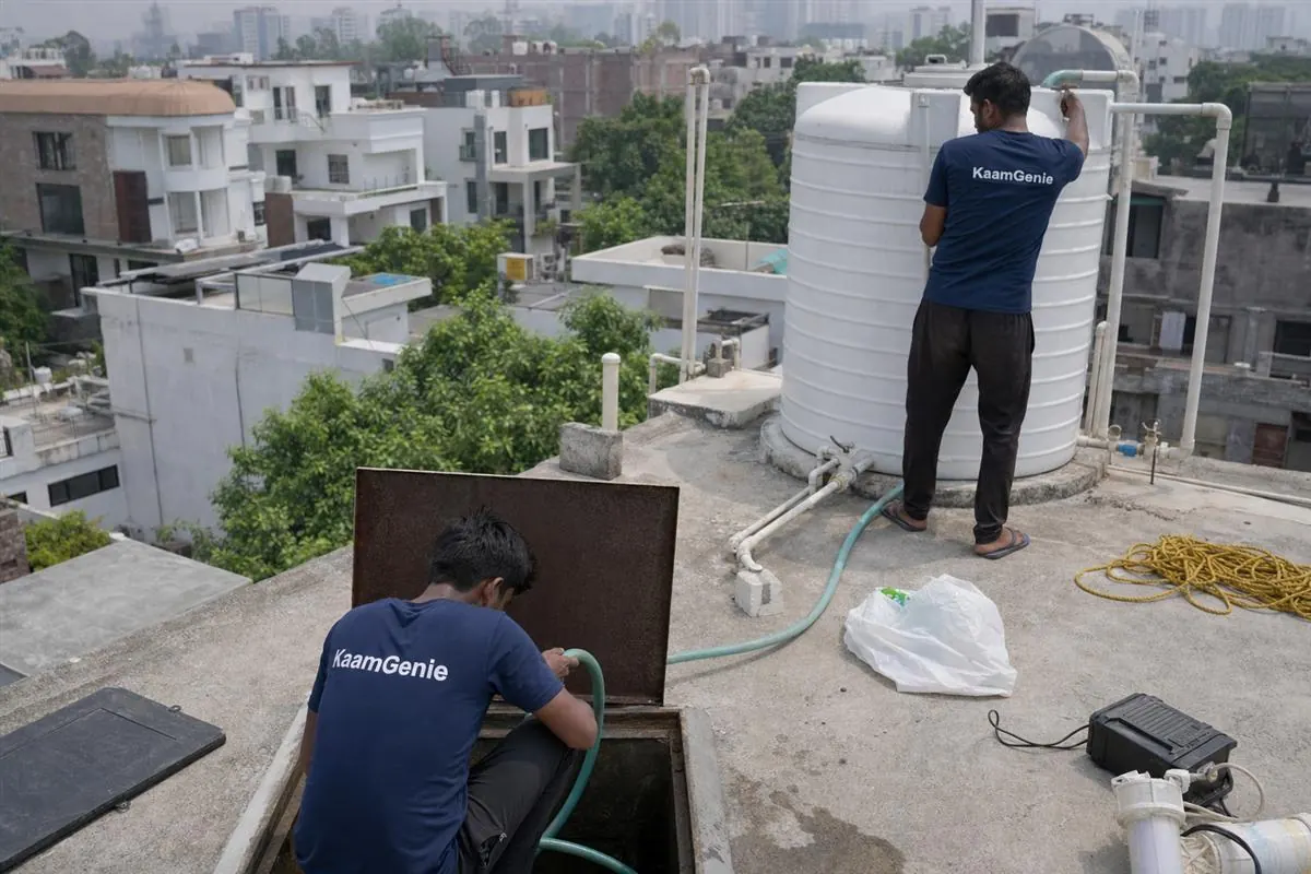 KaamGenie crew cleaning a water tank in Sector 10, Gurgaon