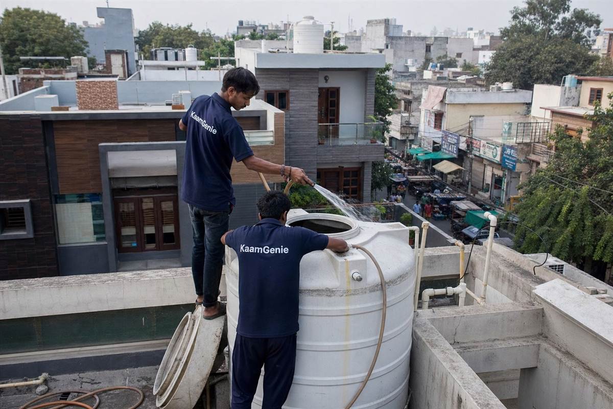 KaamGenie crew cleaning a water tank in Sector 16, Gurgaon
