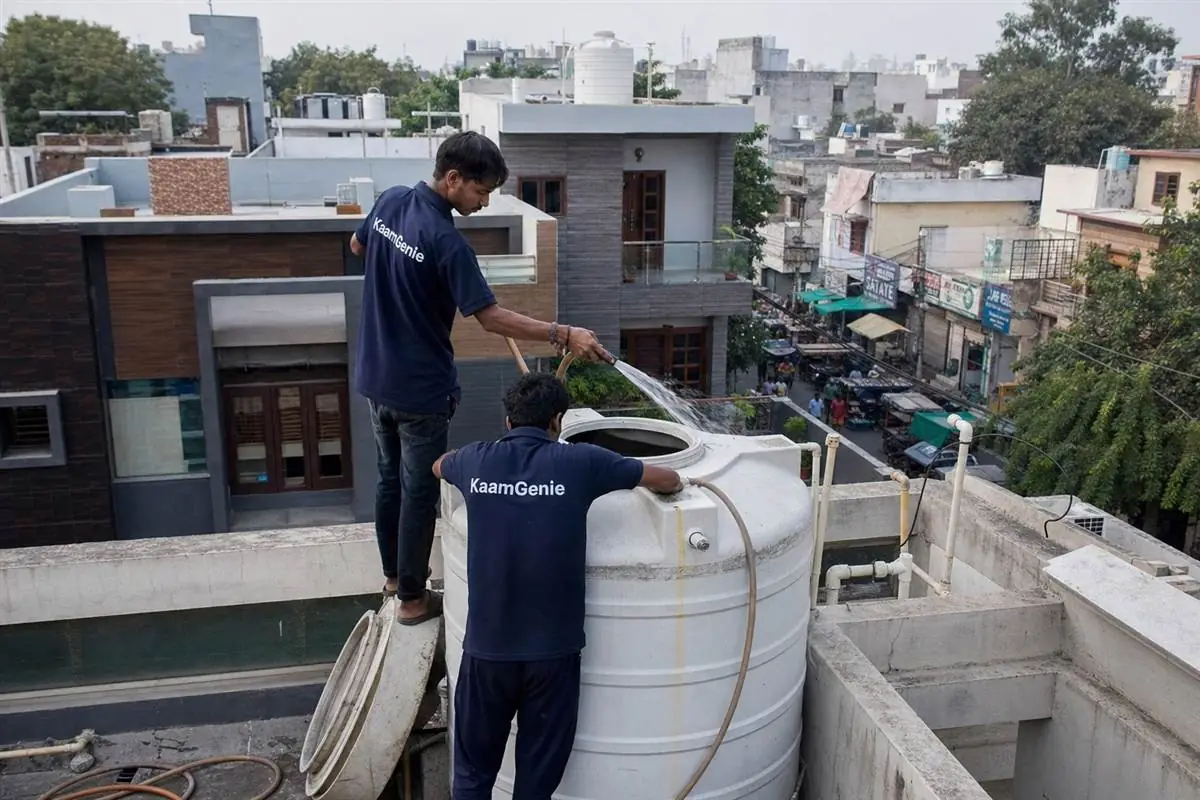 KaamGenie crew cleaning a water tank in Sector 16, Gurgaon