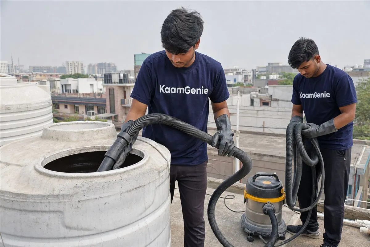 KaamGenie crew cleaning a water tank in Sector 21, Gurgaon
