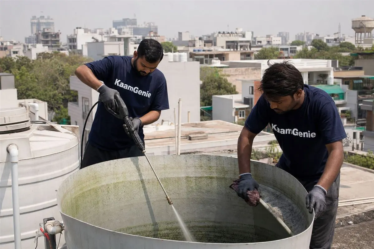 KaamGenie crew cleaning a water tank in Sector 23, Gurgaon