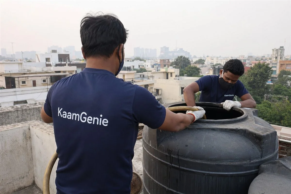 KaamGenie crew cleaning a water tank in Sector 25, Gurgaon