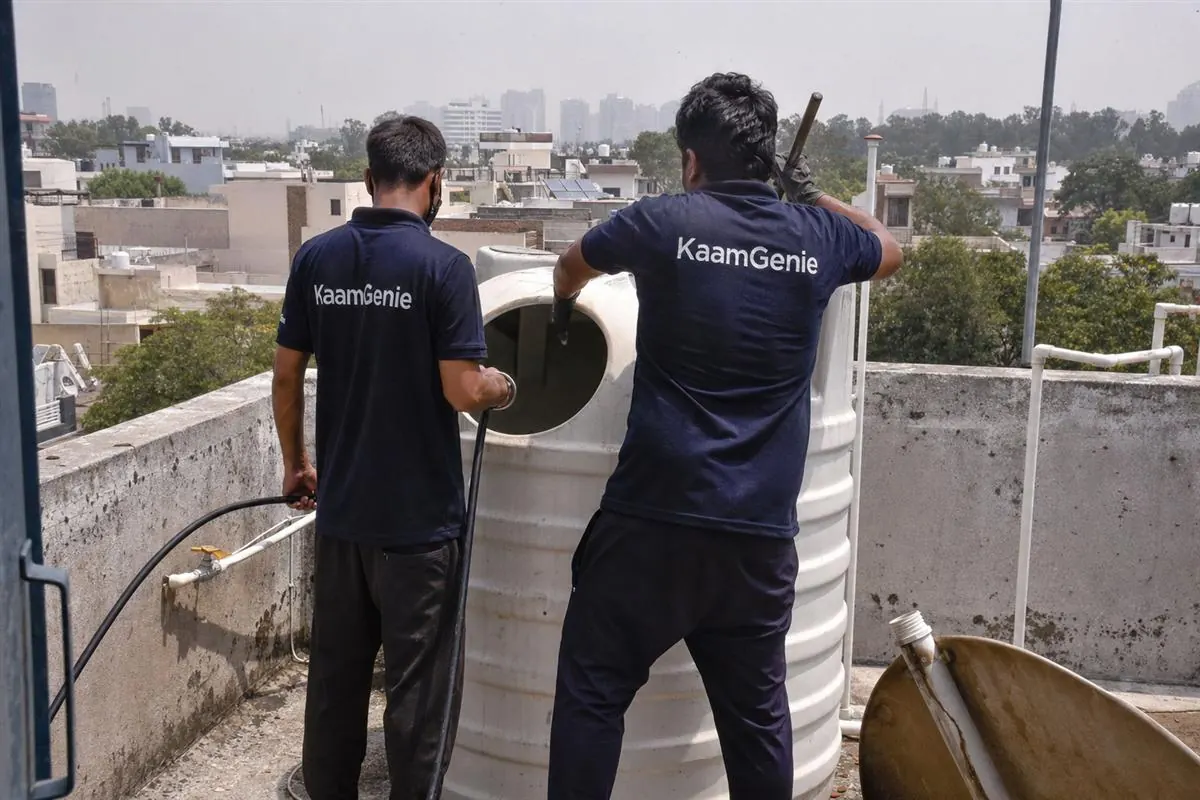 KaamGenie crew cleaning a water tank in Sector 30, Gurgaon