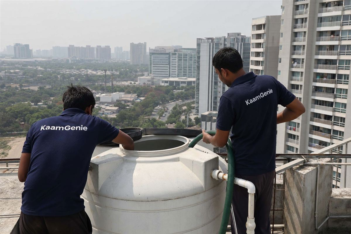 KaamGenie crew cleaning a water tank in Sector 38, Gurgaon