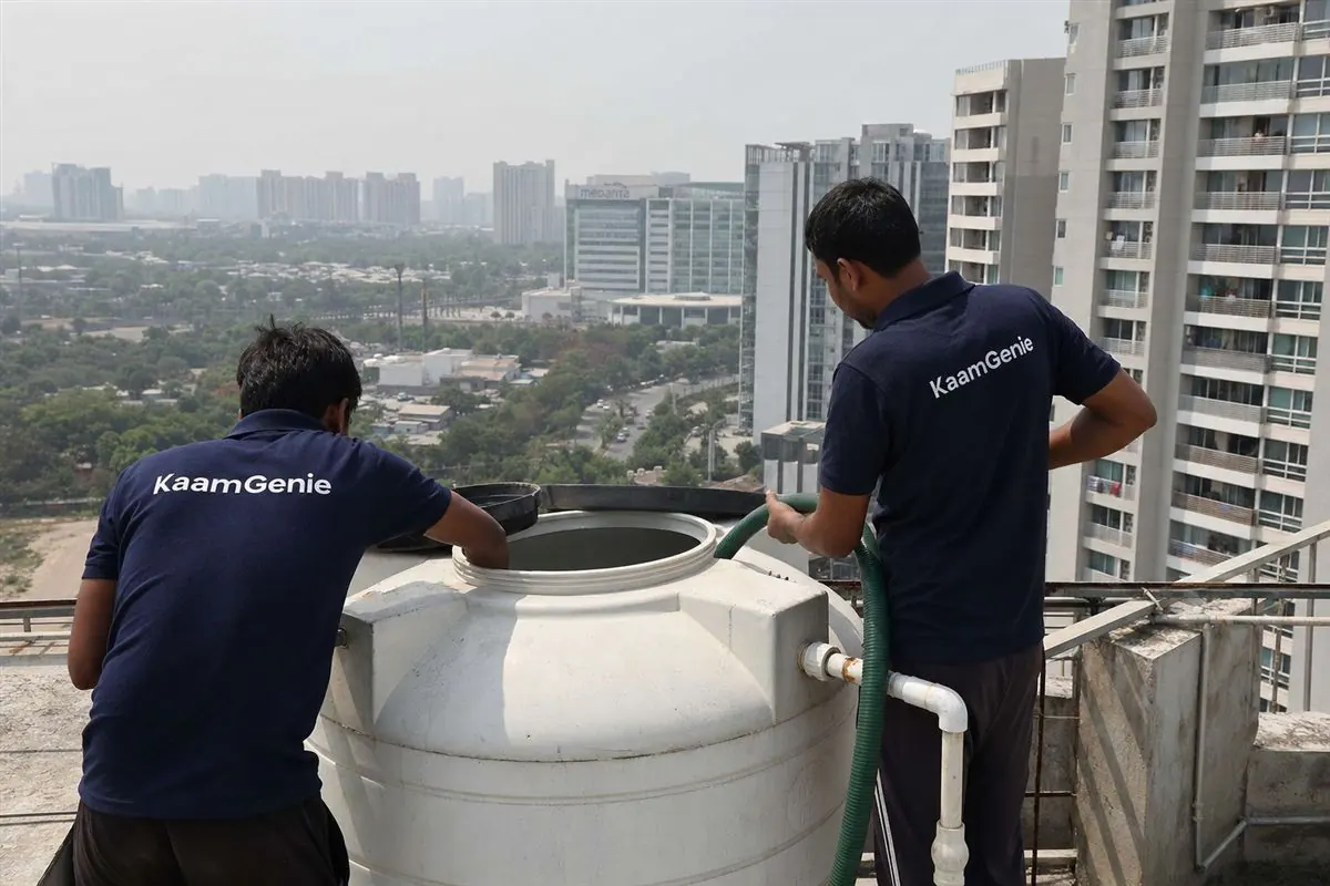 KaamGenie crew cleaning a water tank in Sector 38, Gurgaon