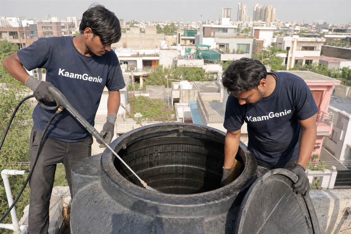 KaamGenie crew cleaning a water tank in Sector 4, Gurgaon