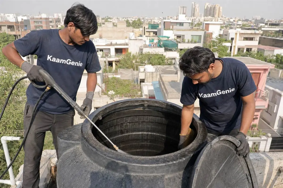 KaamGenie crew cleaning a water tank in Sector 4, Gurgaon