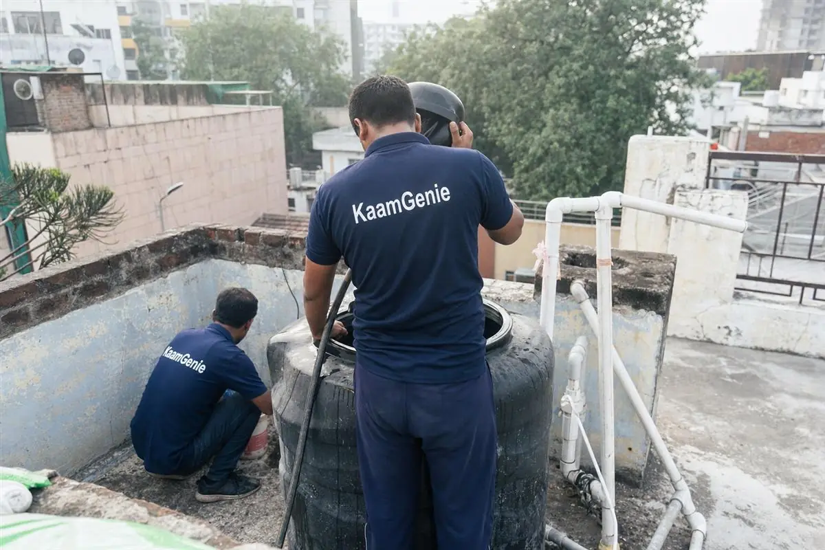KaamGenie crew cleaning a water tank in Sector 5, Gurgaon