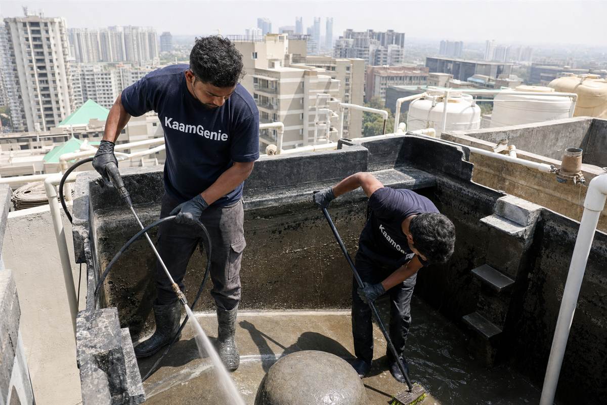 KaamGenie crew cleaning a water tank in Sector 61, Gurgaon