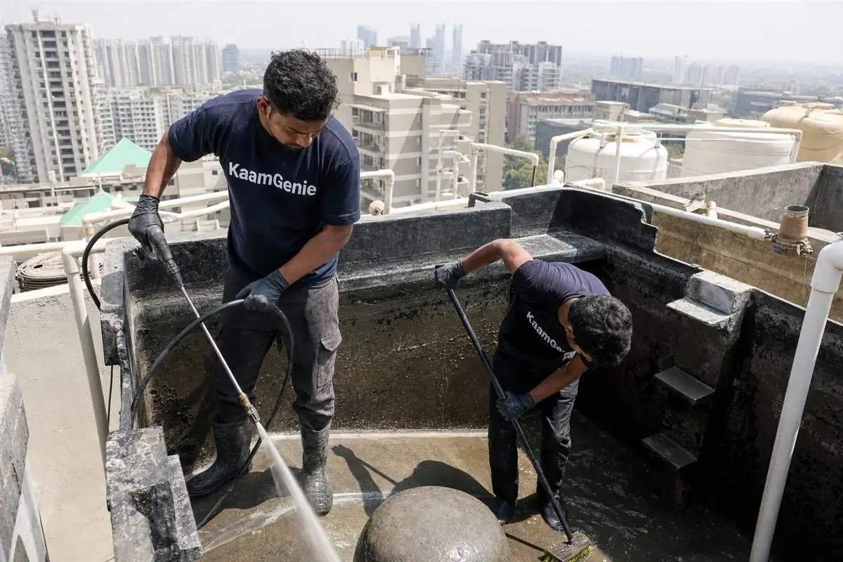 KaamGenie crew cleaning a water tank in Sector 61, Gurgaon