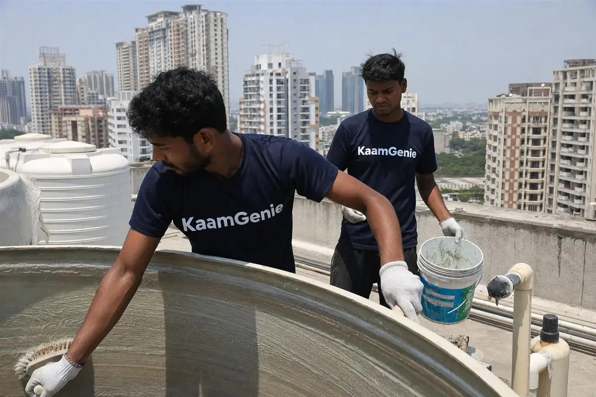KaamGenie crew cleaning a water tank in Sector 65, Gurgaon