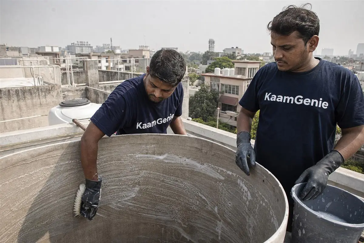 KaamGenie crew cleaning a water tank in Sector 7, Gurgaon