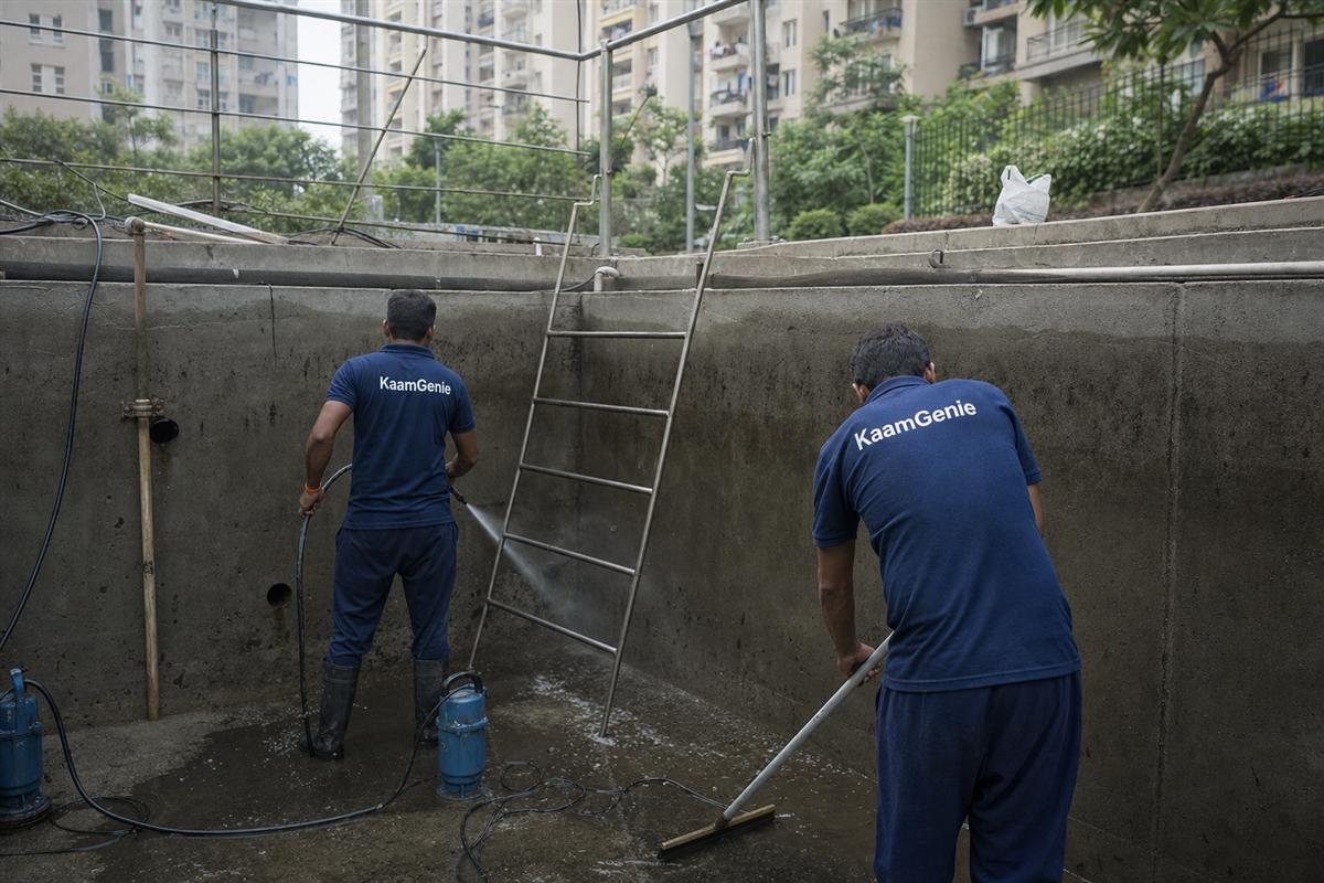 KaamGenie crew cleaning a water tank in Sector 78, Gurgaon