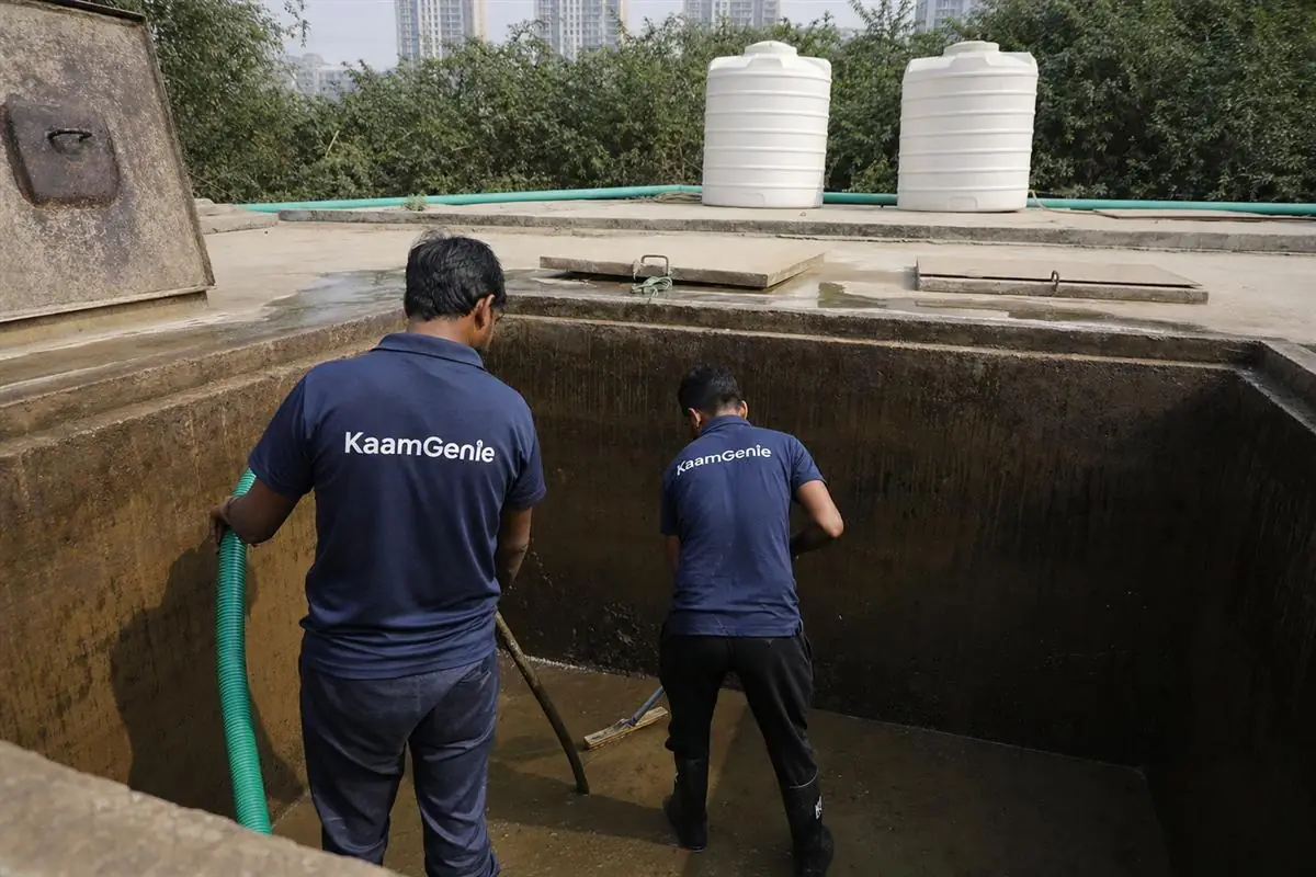 KaamGenie crew cleaning a water tank in Sector 81, Gurgaon