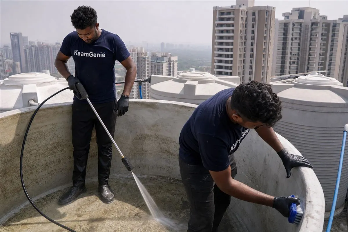 KaamGenie crew cleaning a water tank in Sector 89, Gurgaon