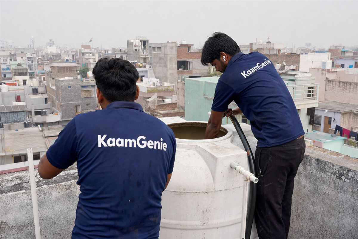 KaamGenie crew cleaning a water tank in Sheetla Colony, Gurgaon