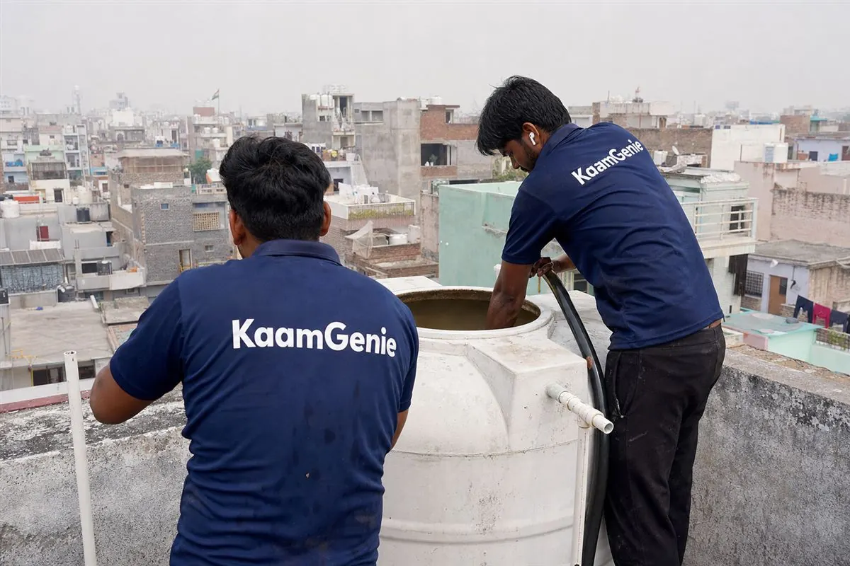 KaamGenie crew cleaning a water tank in Sheetla Colony, Gurgaon