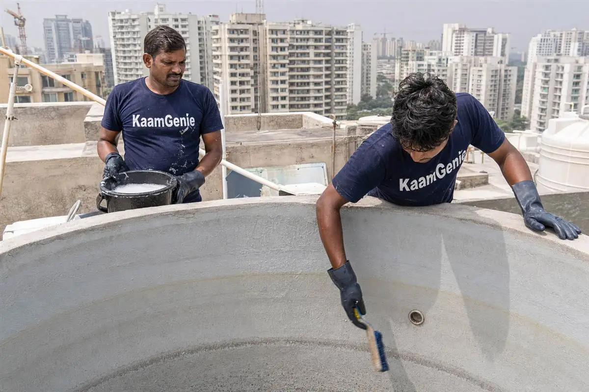 KaamGenie crew cleaning a water tank in Sushant Lok 3, Gurgaon