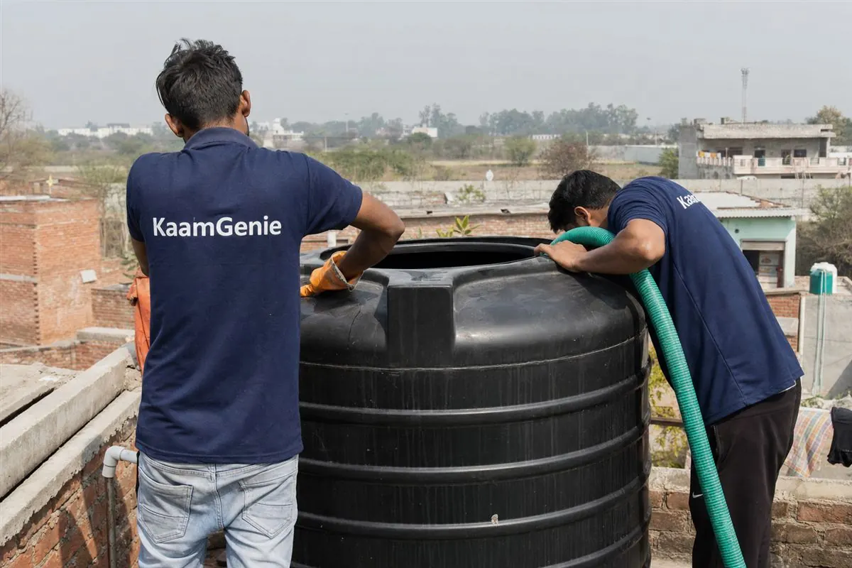 KaamGenie crew cleaning a water tank in Wazirabad, Gurgaon