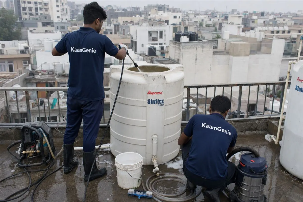 KaamGenie crew cleaning a water tank in Hauz Rani, Delhi
