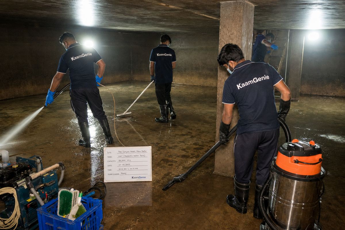 KaamGenie crew cleaning a large underground water reservoir at a Delhi hotel overnight while guests sleep